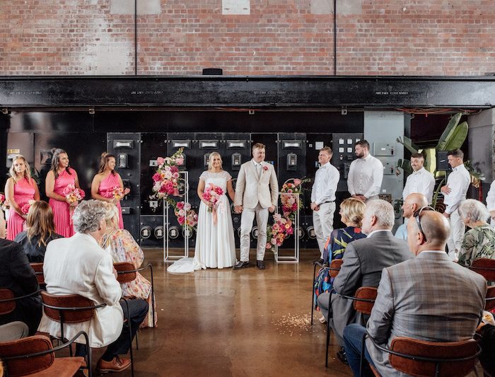 Alex & Jackson and the wedding guests having wedding ceremony in front of the Switch - powerhouse, dedicated event space at 1915 in geelong