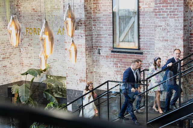 people climbing staircase to mezzanine level for an entire function event booking